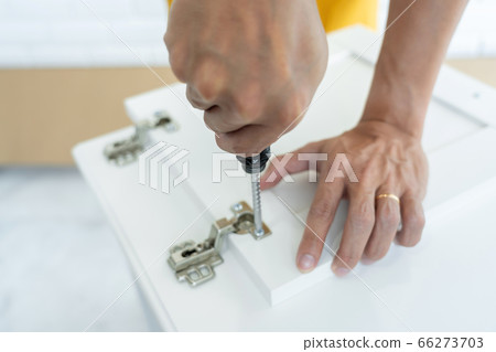Technician Worker Fixing The Door Lock With Technician Worker Fixing The Door Lock With 66273703