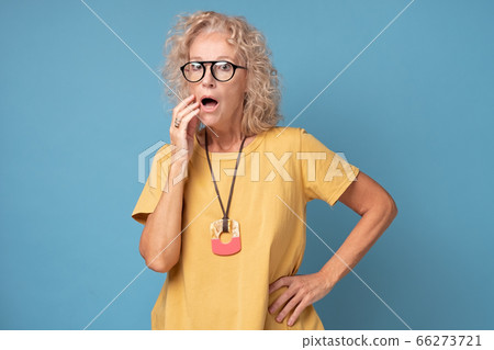 An old caucasian blonde lady expresses shock or surprise An old caucasian blonde lady expresses shock or surprise 66273721