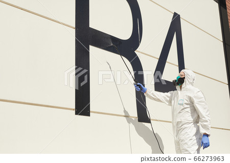 Worker Disinfecting Hangar Copy Space 66273963