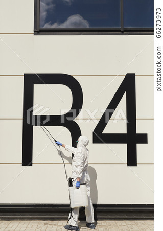 Worker Disinfecting Hangar 66273973