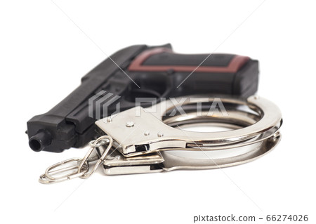Gun and handcuffs isolated on white background 66274026