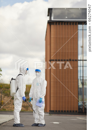 Disinfection Workers Standing in Street 66274047