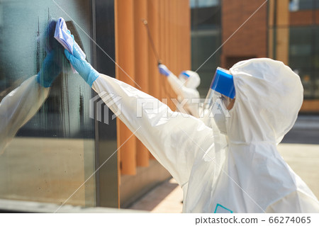 Female Worker Cleaning Windows Outdoors 66274065