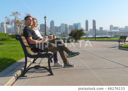 Couple relaxing on San Diego City bench 66276133