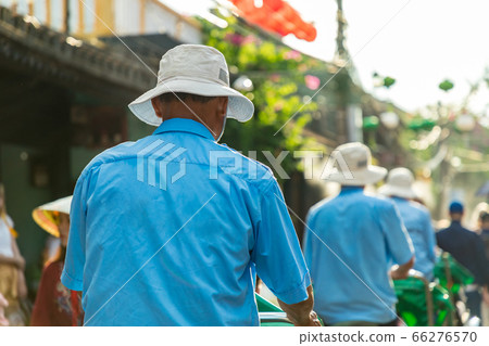 Cycling in the city of Hoi An, Vietnam 66276570