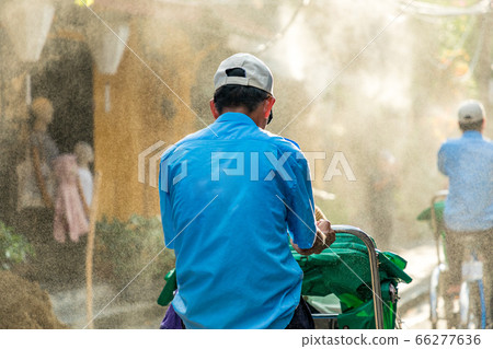 Mist and cyclo sprayed in the city of Hoi An, Vietnam Mist and cyclo sprayed in the city of Hoi An, Vietnam 66277636