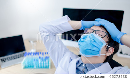 Overworked doctor feeling tired in clinic Overworked doctor feeling tired in clinic 66278388