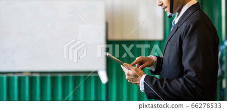 Manager check stock on tablet in warehouse Manager check stock on tablet in warehouse 66278533