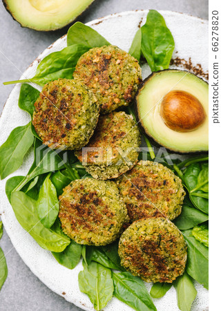 Vegetarian avocado spinach falafel 66278820