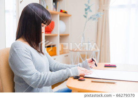 Woman with a seal stamp Copy space 66279370