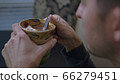 High quality close-up 4k slow motion video of a man drinking hot chocolate beverage 66279451
