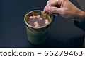 High quality close-up 4k slow motion video of a man mixing hot chocolate beverage 66279463