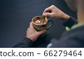 High quality close-up 4k slow motion video of a man mixing hot chocolate beverage 66279464