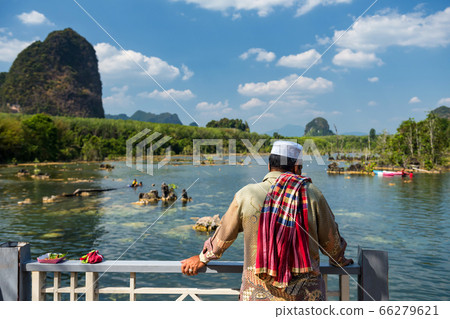 Muslim man visit Klong Rood, Krabi Muslim man visit Klong Rood, Krabi 66279621