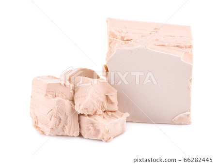 Fresh pressed yeast, isolated on white background. 66282445