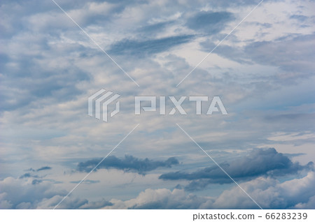 Natural sky composition. Sunny vast blue sky abstract background. Beautiful cloudscape, view over white fluffy clouds. Freedom concept, on the heaven. Element of design. 66283239