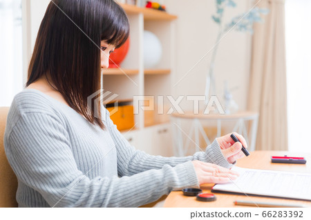 Woman with a seal stamp Copy space 66283392