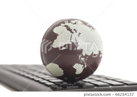 Earth on keyboard isolated on white Earth on keyboard isolated on white 66284137