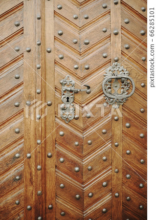 Old wooden door with rivets. Old wooden door with rivets. 66285101
