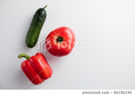 Pepper tomato cucumber on a white background. Minimum concept. Top view Pepper tomato cucumber on a white background. Minimum concept. Top view 66286246
