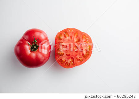 Tomatoes on a white background. Minimum concept Tomatoes on a white background. Minimum concept 66286248
