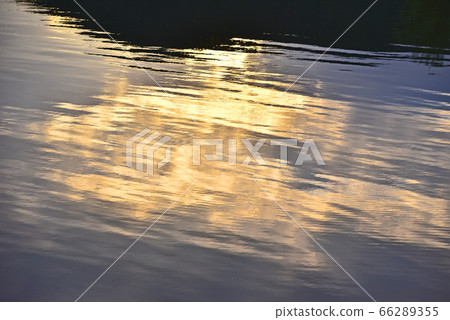 A calm wave at dusk A calm wave at dusk 66289355