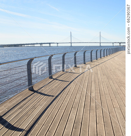 Embankment of Neva River and cable bridge. Embankment of Neva River and cable bridge. 66290367