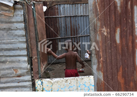 Cox's Bazar in Bangladesh A Muslim village along the coast A child shopping and returning to a prefabricated house 66290734