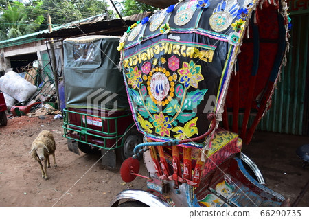 Cox's Bazar of Bangladesh A cute sheep walking along the road of a rickshaw decorated with flashy art Cox's Bazar of Bangladesh A cute sheep walking along the road of a rickshaw decorated with flashy art 66290735
