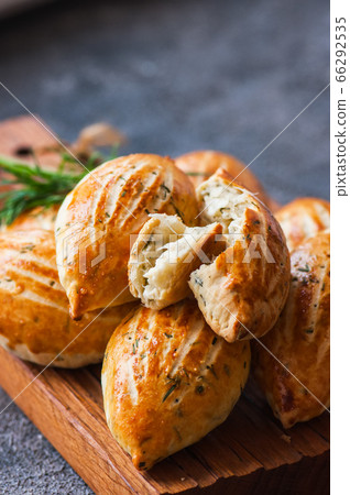 Turkish mini hand pies acma with cheese and herbs. 66292535