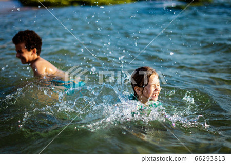 funny children playing in the water 66293813