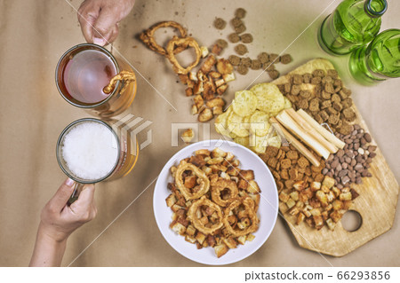 Drinking beer. Table full of beer snacks Drinking beer. Table full of beer snacks 66293856
