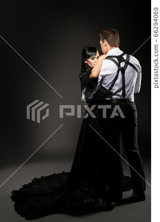 Sexy young couple embracing in the dark shot Sexy young couple embracing in the dark shot 66294069