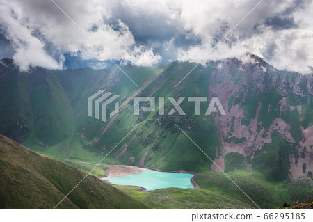 Beautiful landscape with clouds over mountains and lake. Nature landscape. 66295185
