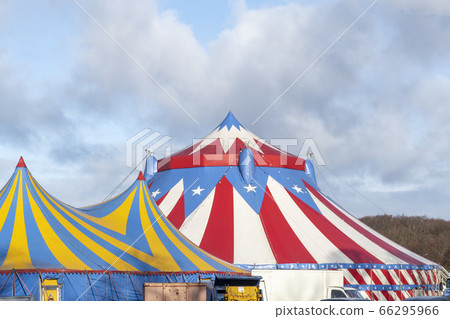 Red and white circus tent topped with bleu starred Red and white circus tent topped with bleu starred 66295966