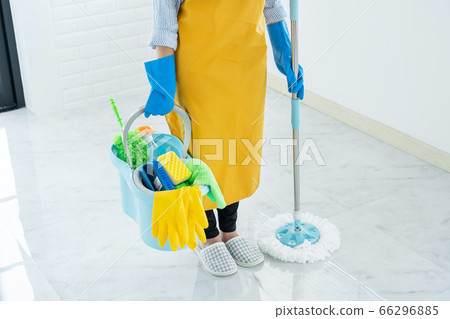 Young housekeeper or washing cleaning floor at mop Young housekeeper or washing cleaning floor at mop 66296885