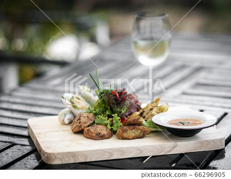 mixed asian seafood snacks platter on restaurant 66296905