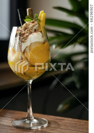 mango and passion fruit tropical ice cream sundae 66296907
