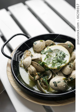sauteed clams tapas in lemon garlic parsley sauce sauteed clams tapas in lemon garlic parsley sauce 66296917