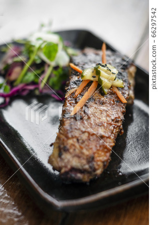 marinated grilled barbecue pork rib with salad 66297542