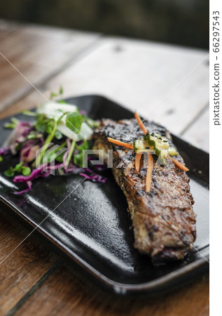 marinated grilled barbecue pork rib with salad 66297543