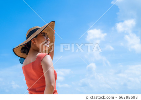 Woman in the summer sea 66298698