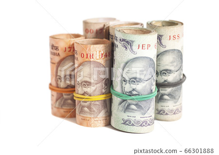 Rolls of Indian rupees isolated on white Rolls of Indian rupees isolated on white 66301888
