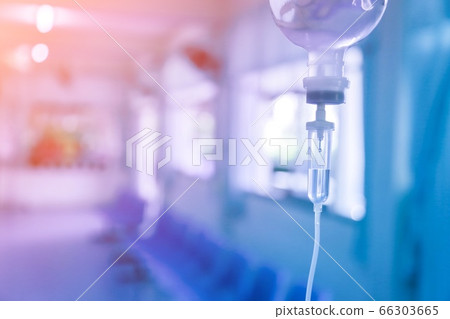 Saline iv bag intravenous drip hospital room,Medical Concept,treatment and injection vitamin natural drug infusion care chemotherapy concept.green light background hospital,Selective focus Saline iv bag intravenous drip hospital room,Medical Concept,treatment and injection vitamin natural drug infusion care chemotherapy concept.green light background hospital,Selective focus 66303665