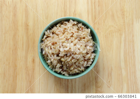 Brown Rice on Wooden Table 66303841