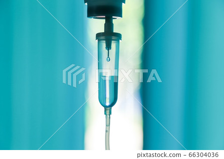 Set saline drip iv fluid intravenous drop saline drip hospital room,Medical Concept,treatment emergency and injection drug infusion care chemotherapy, concept.blue light background,selective focus Set saline drip iv fluid intravenous drop saline drip hospital room,Medical Concept,treatment emergency and injection drug infusion care chemotherapy, concept.blue light background,selective focus 66304036