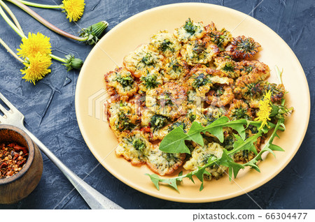 Deep frying dandelion 66304477