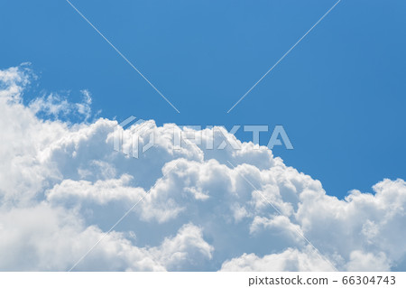 Cumulus cloud relief on a smooth background of clear summer sky. 66304743