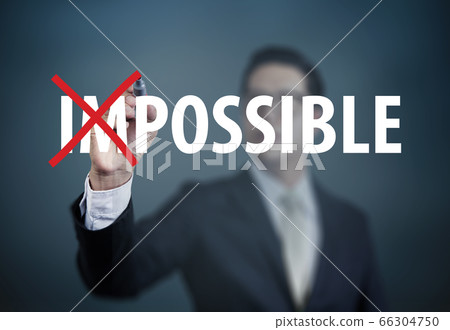 Businessman hand Changing the word "impossible to 66304750