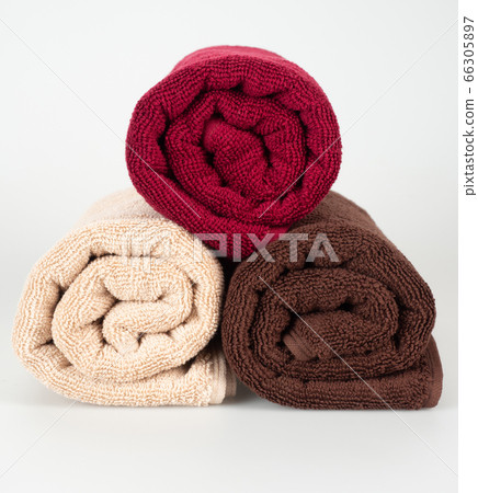 multicolored towels on a white background multicolored towels on a white background 66305897